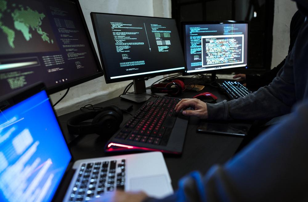 Image of person on two computers 