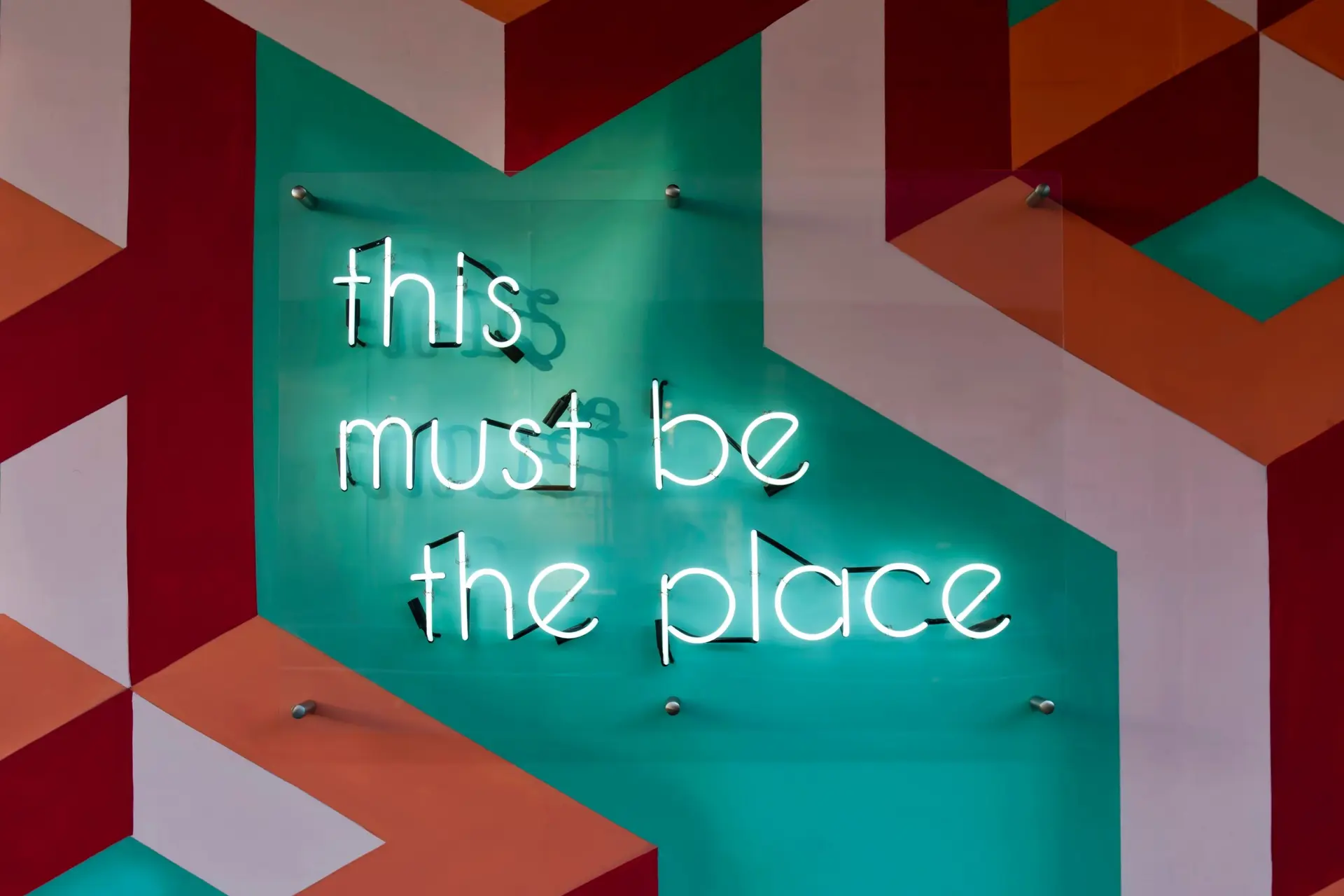 A neon sign saying 'This must be the place'